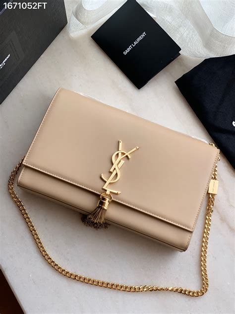 ysl beige tassel clutch|ysl clutch bag with tassel.